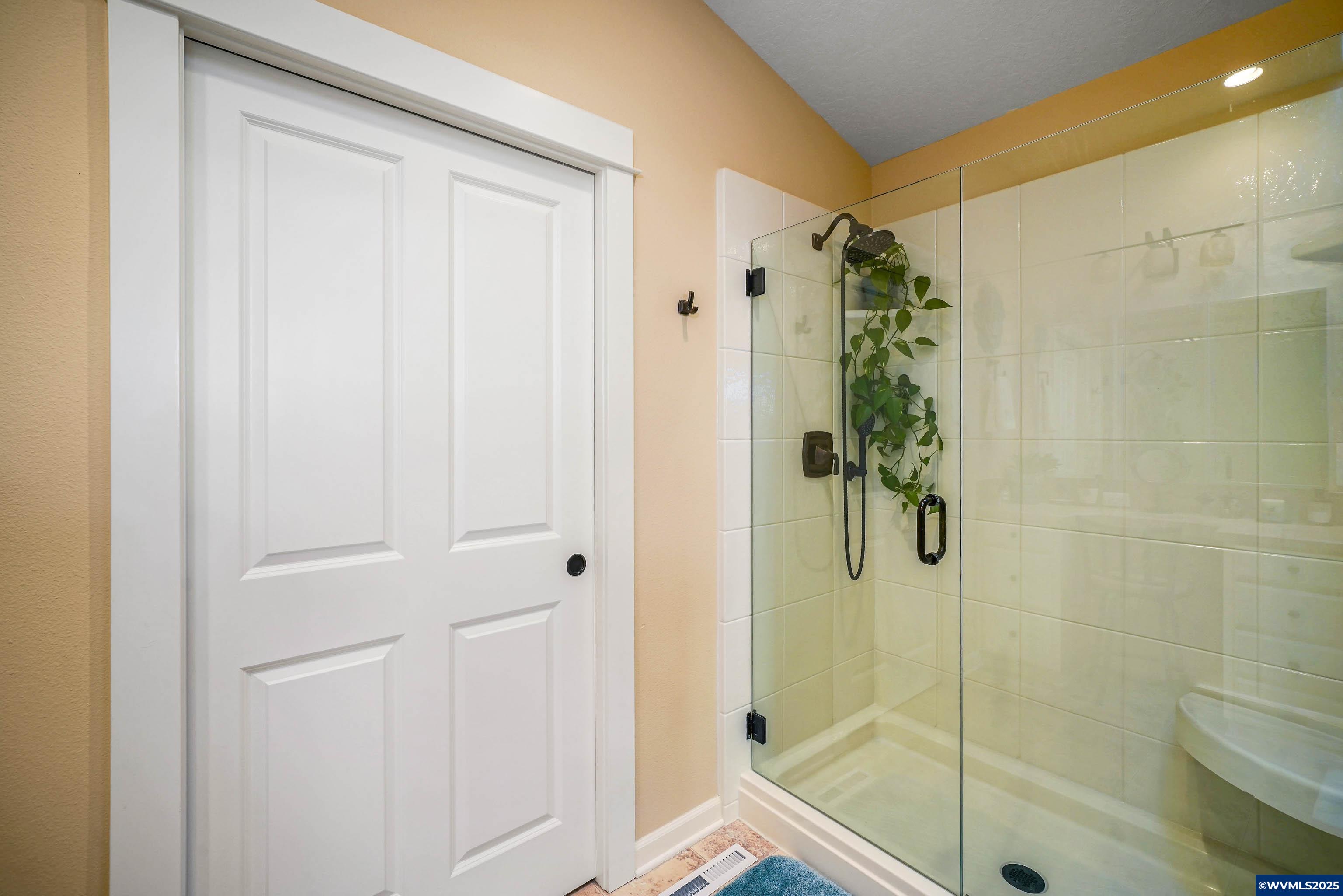 2224 Southeast Rhododendron Avenue Dallas, OR 97338 - Photo 32 of 38 a bathroom with a shower and a sink