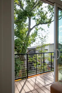 a view of a balcony with wooden floor