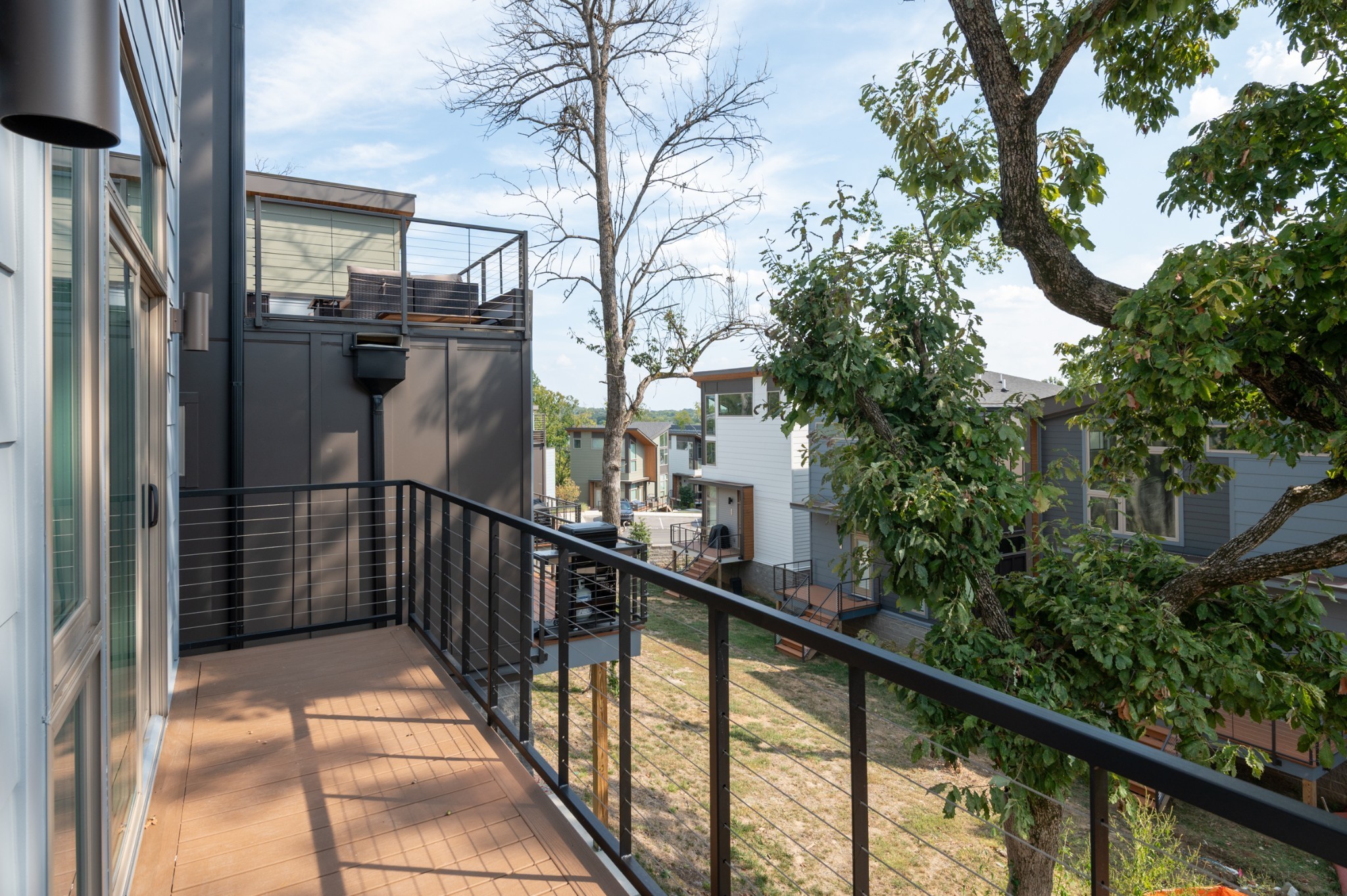 3026 Edwin Street Nashville, TN 37207 - Photo 17 of 48 a view of a balcony with a potted plant and a large tree