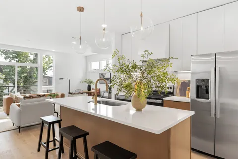 a kitchen with a table and chairs
