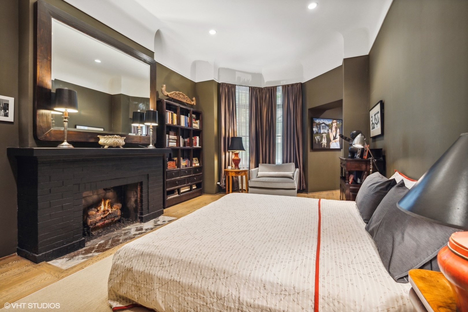 24 East Division Street Chicago, IL 60610 - Photo 11 of 52 a bed room with a bed and a fireplace