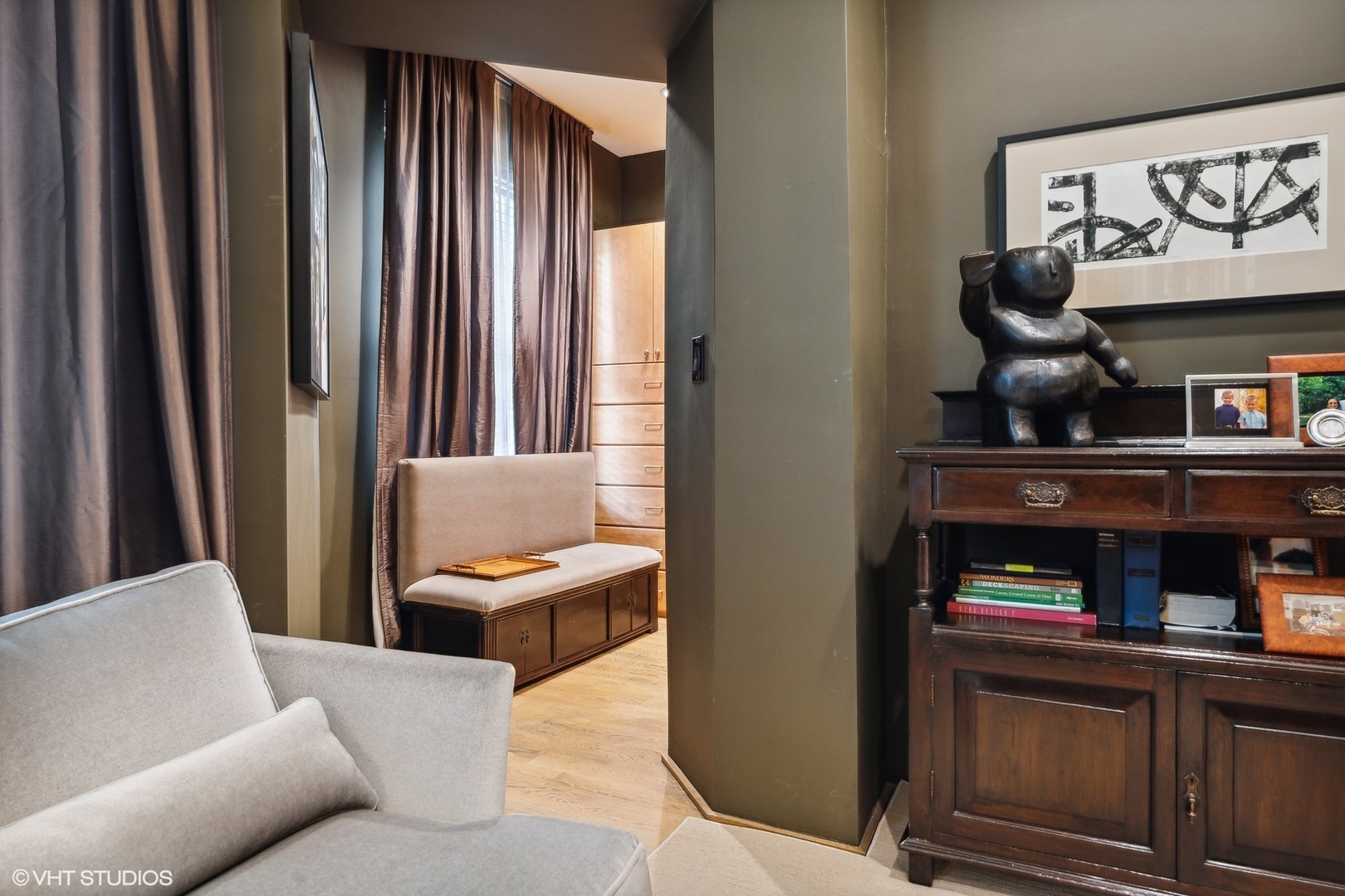 24 East Division Street Chicago, IL 60610 - Photo 12 of 52 a living room with furniture and painting on the wall