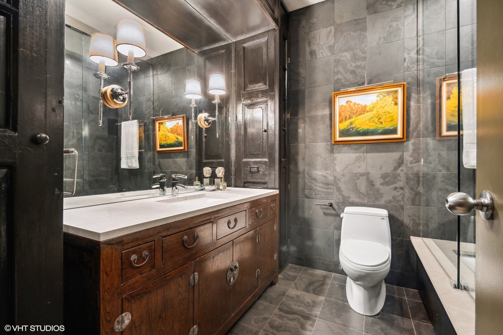 24 East Division Street Chicago, IL 60610 - Photo 13 of 52 a bathroom with a toilet sink and mirror