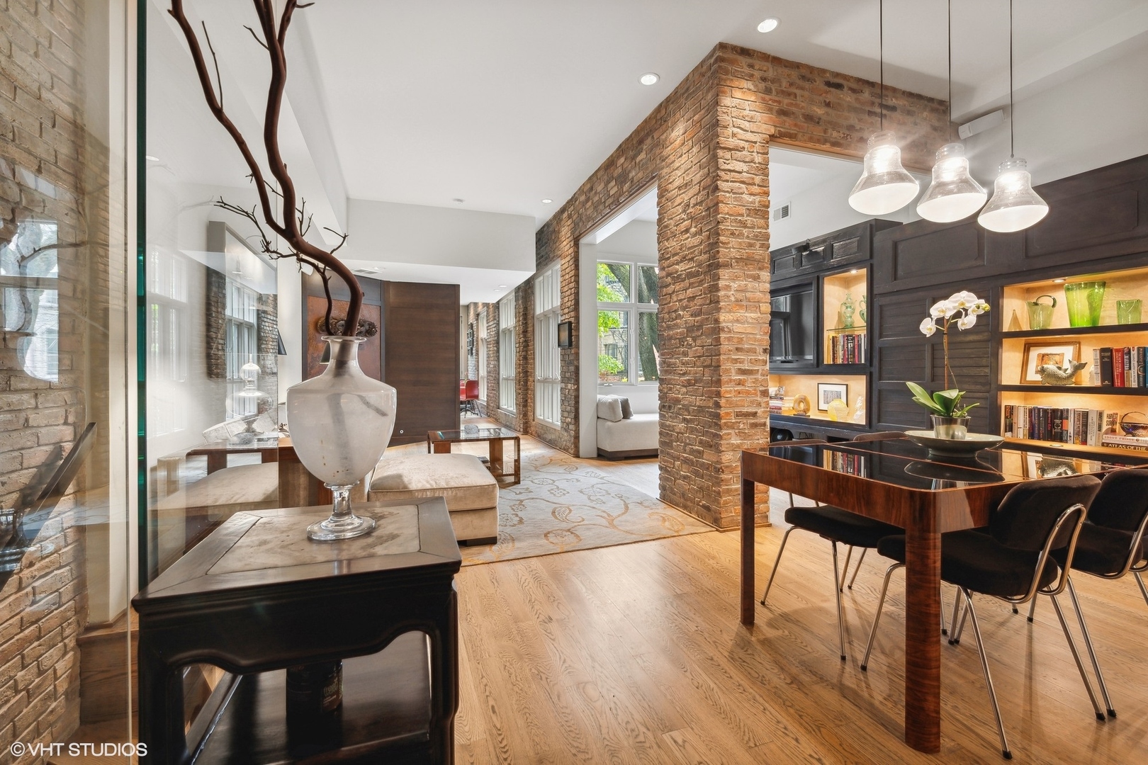 24 East Division Street Chicago, IL 60610 - Photo 14 of 52 a view of a dining room with furniture and wooden floor