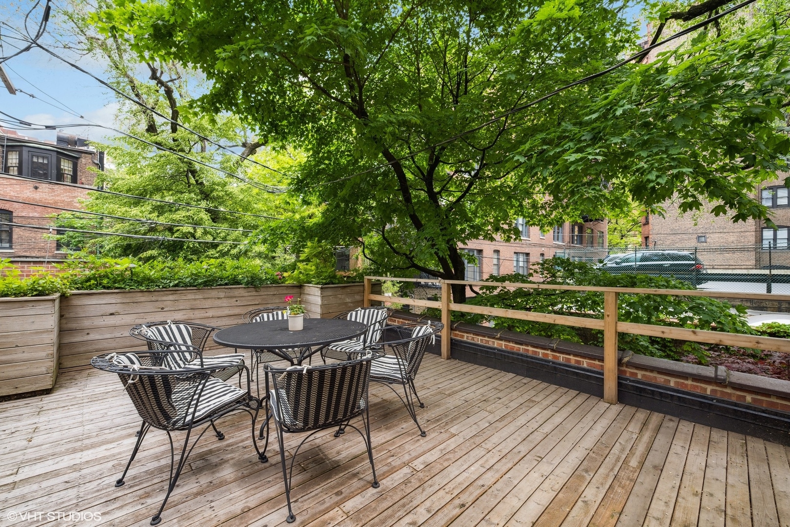 24 East Division Street Chicago, IL 60610 - Photo 22 of 52 a view of backyard with deck and outdoor seating