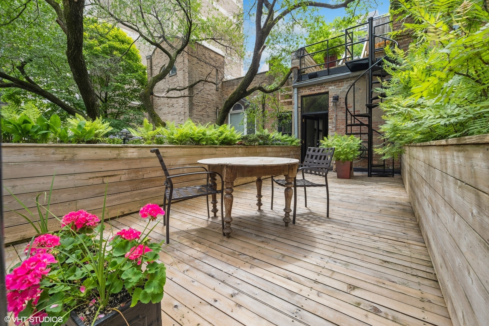 24 East Division Street Chicago, IL 60610 - Photo 26 of 52 a view of a deck with a table and chairs