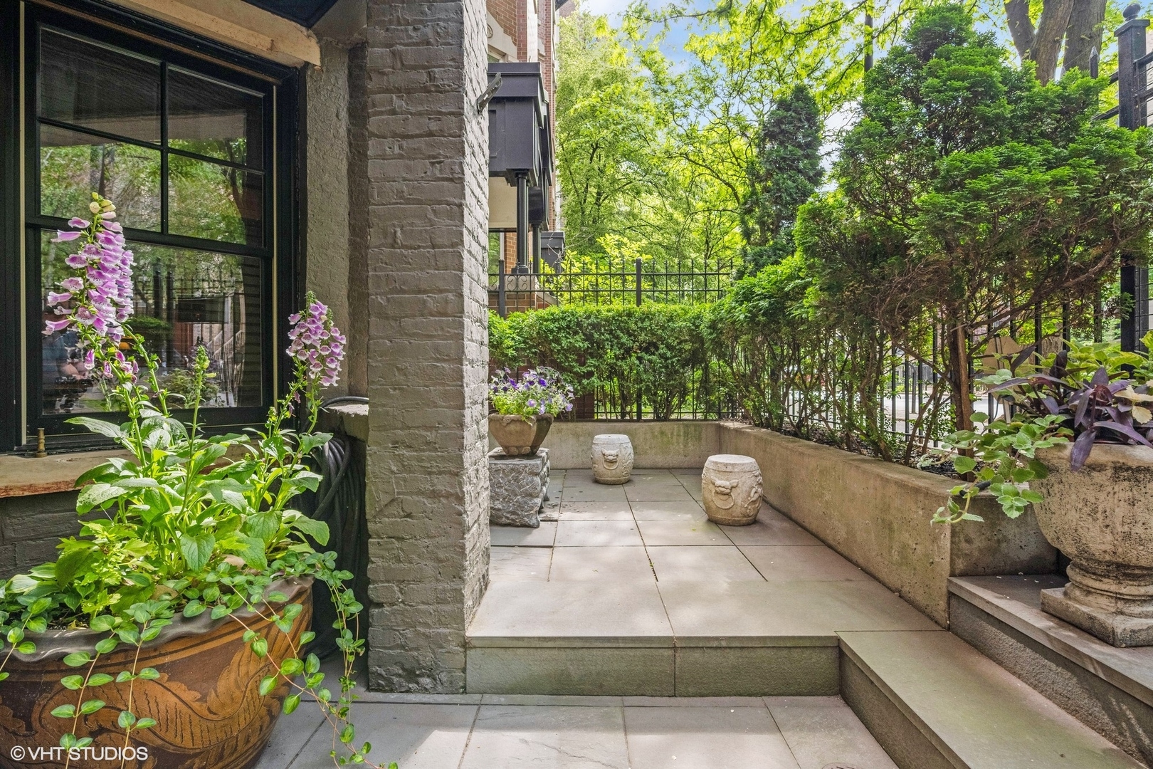 24 East Division Street Chicago, IL 60610 - Photo 3 of 52 a view of a path along with potted plants
