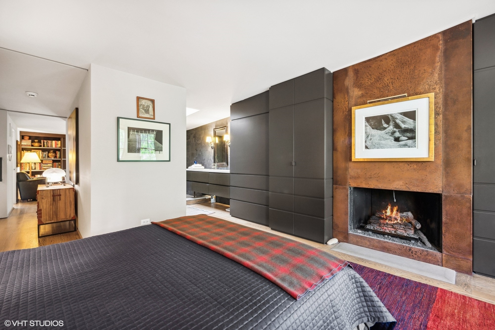 24 East Division Street Chicago, IL 60610 - Photo 35 of 52 a bedroom with a bed and a fireplace