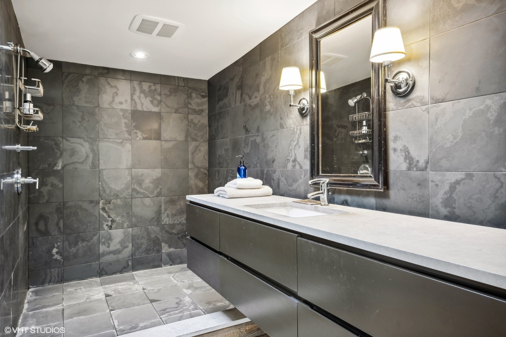 24 East Division Street Chicago, IL 60610 - Photo 36 of 52 a bathroom with a sink and a mirror