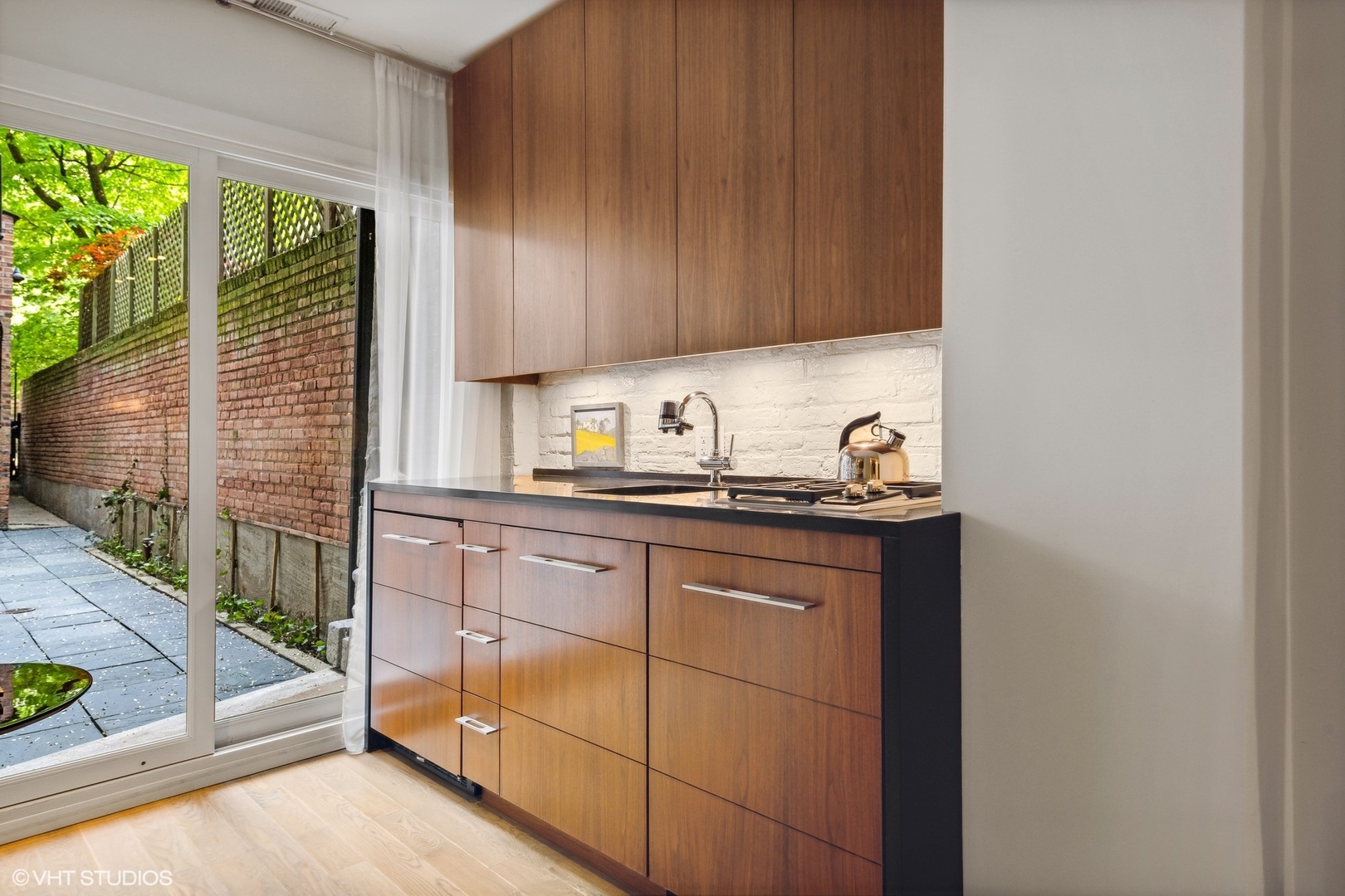 24 East Division Street Chicago, IL 60610 - Photo 40 of 52 a kitchen with sink cabinets and outdoor view