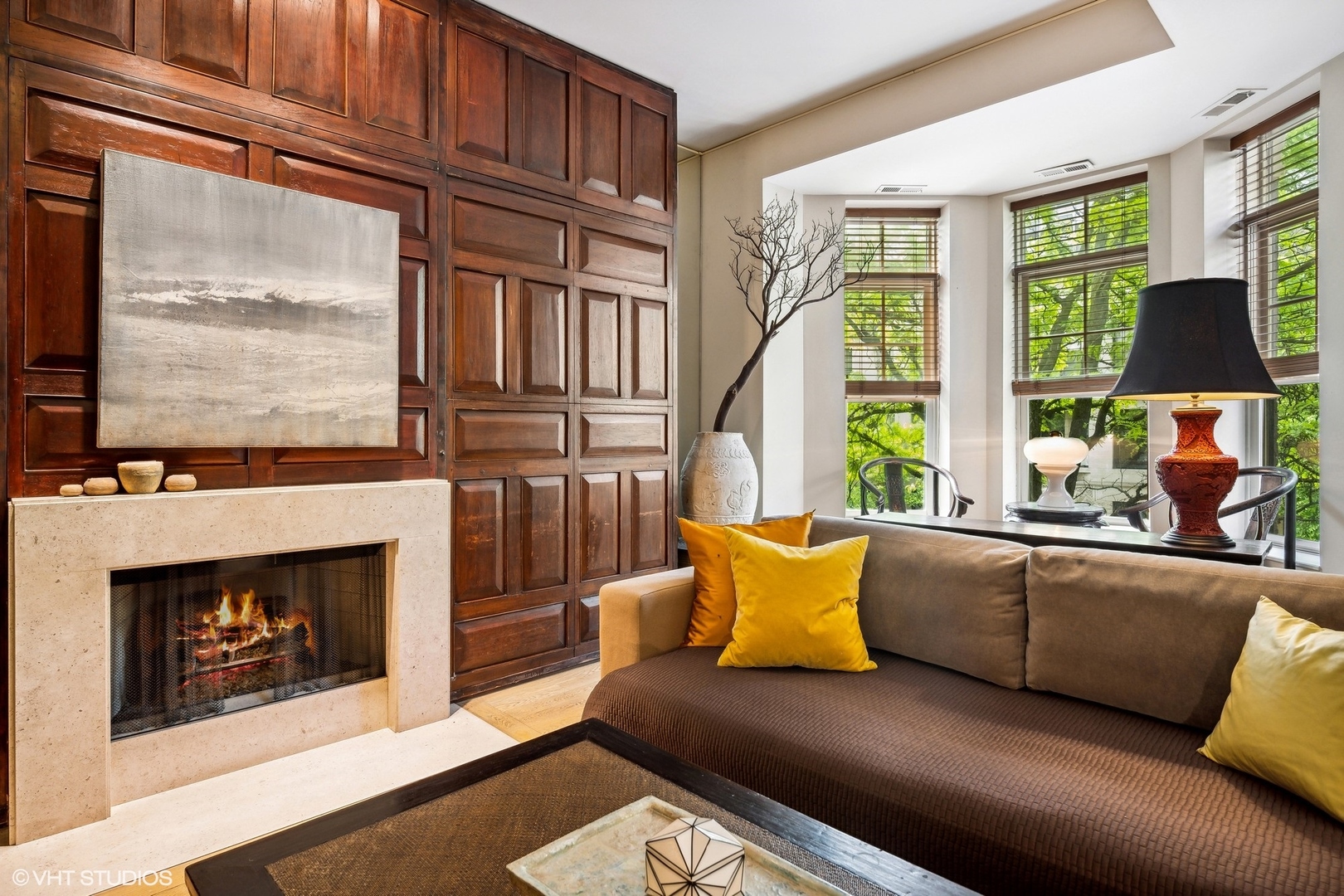 24 East Division Street Chicago, IL 60610 - Photo 46 of 52 a living room with furniture a fireplace and a window
