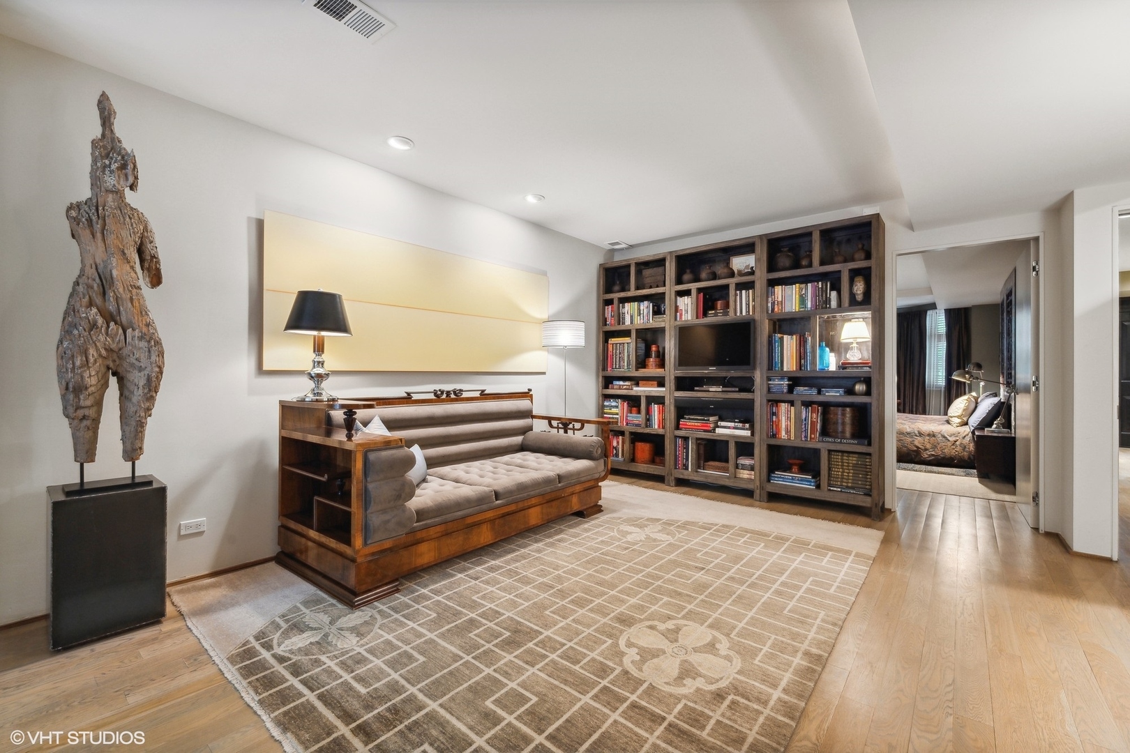 24 East Division Street Chicago, IL 60610 - Photo 9 of 52 a view of a livingroom with furniture and gym equipment