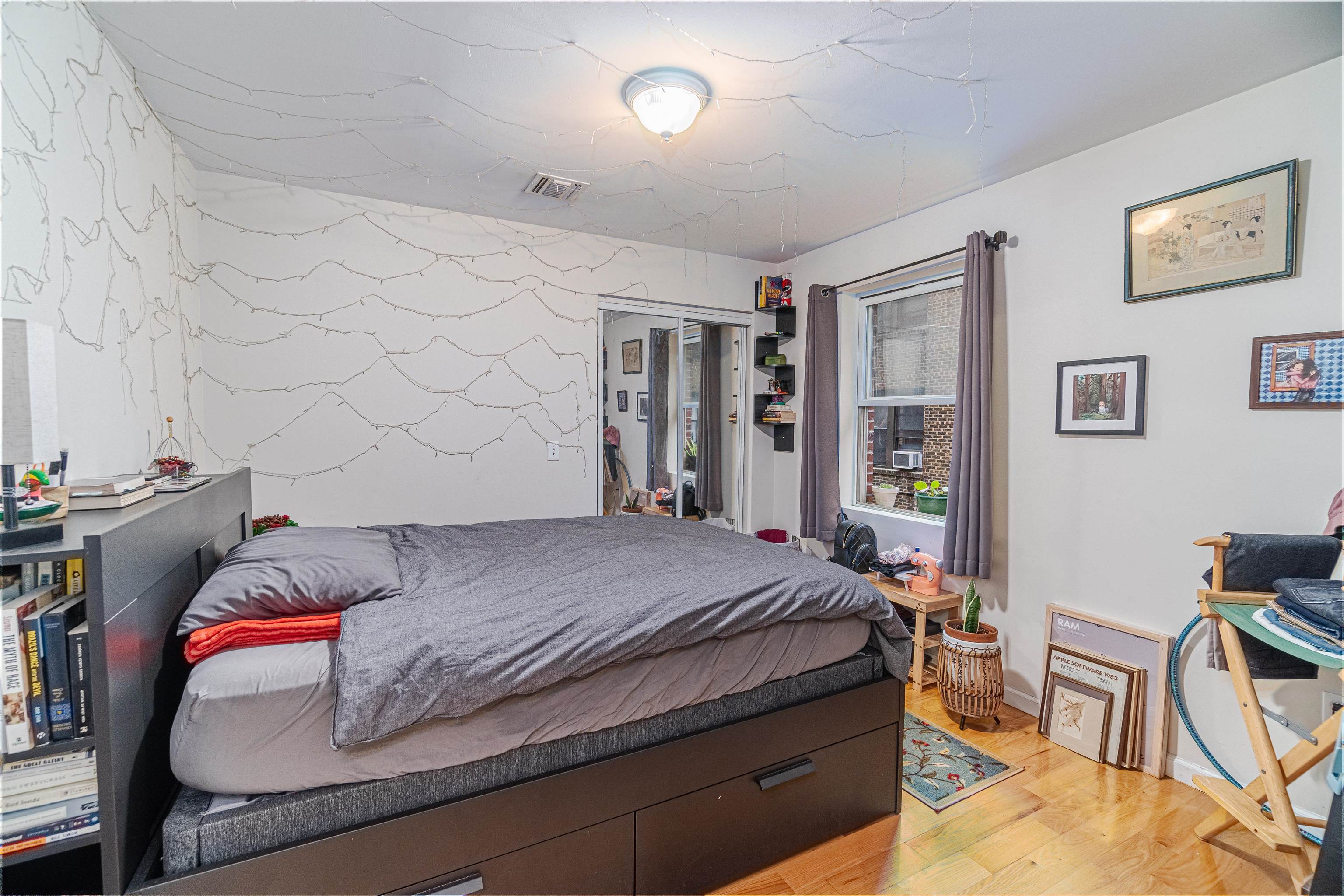 135 38th Street, Unit 302 Union City, NJ 07087 - Photo 12 of 18 a bedroom with a bed and furniture