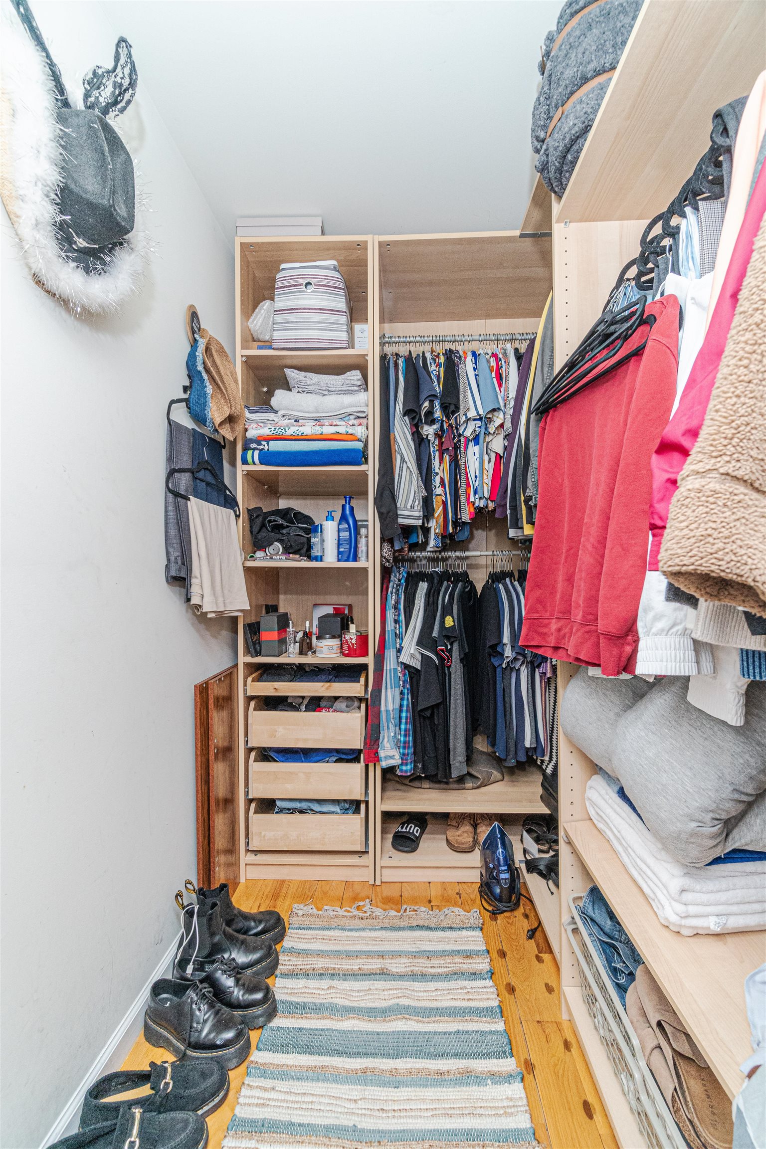 135 38th Street, Unit 302 Union City, NJ 07087 - Photo 13 of 18 a view of walk in closet with clothes and shoes