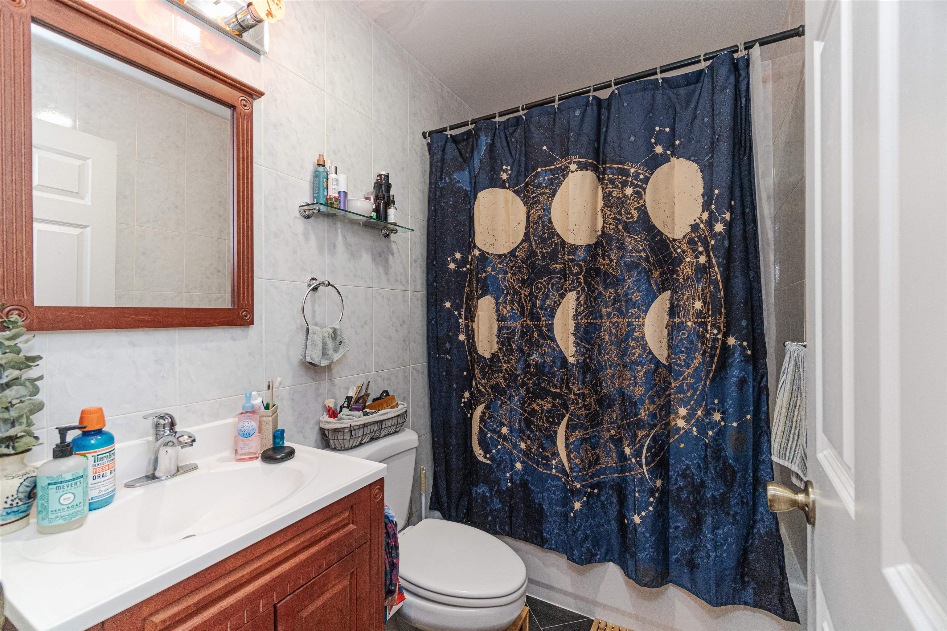 135 38th Street, Unit 302 Union City, NJ 07087 - Photo 15 of 18 a bathroom with a sink toilet and shower