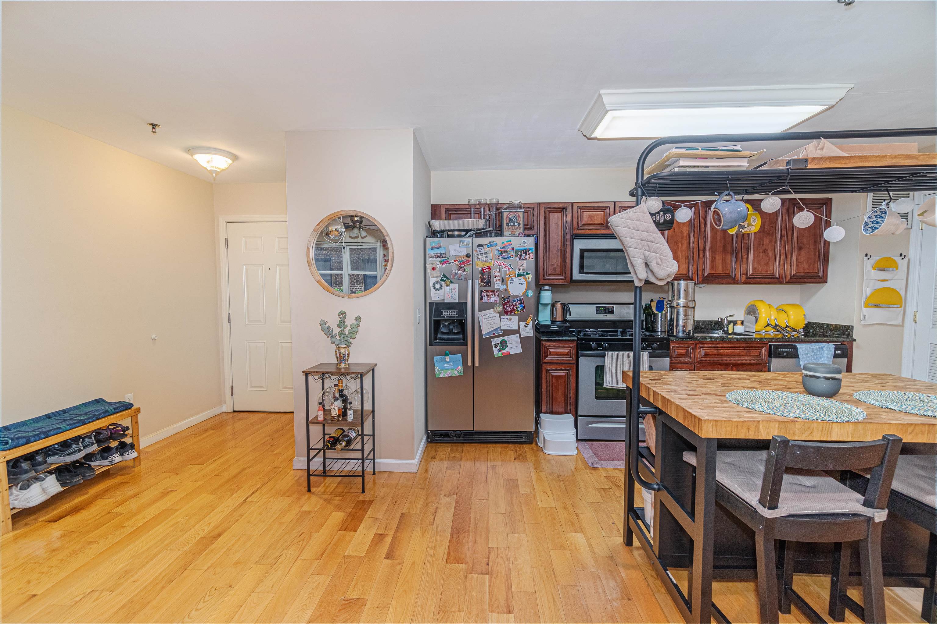 135 38th Street, Unit 302 Union City, NJ 07087 - Photo 10 of 18 a workspace with furniture and wooden floor