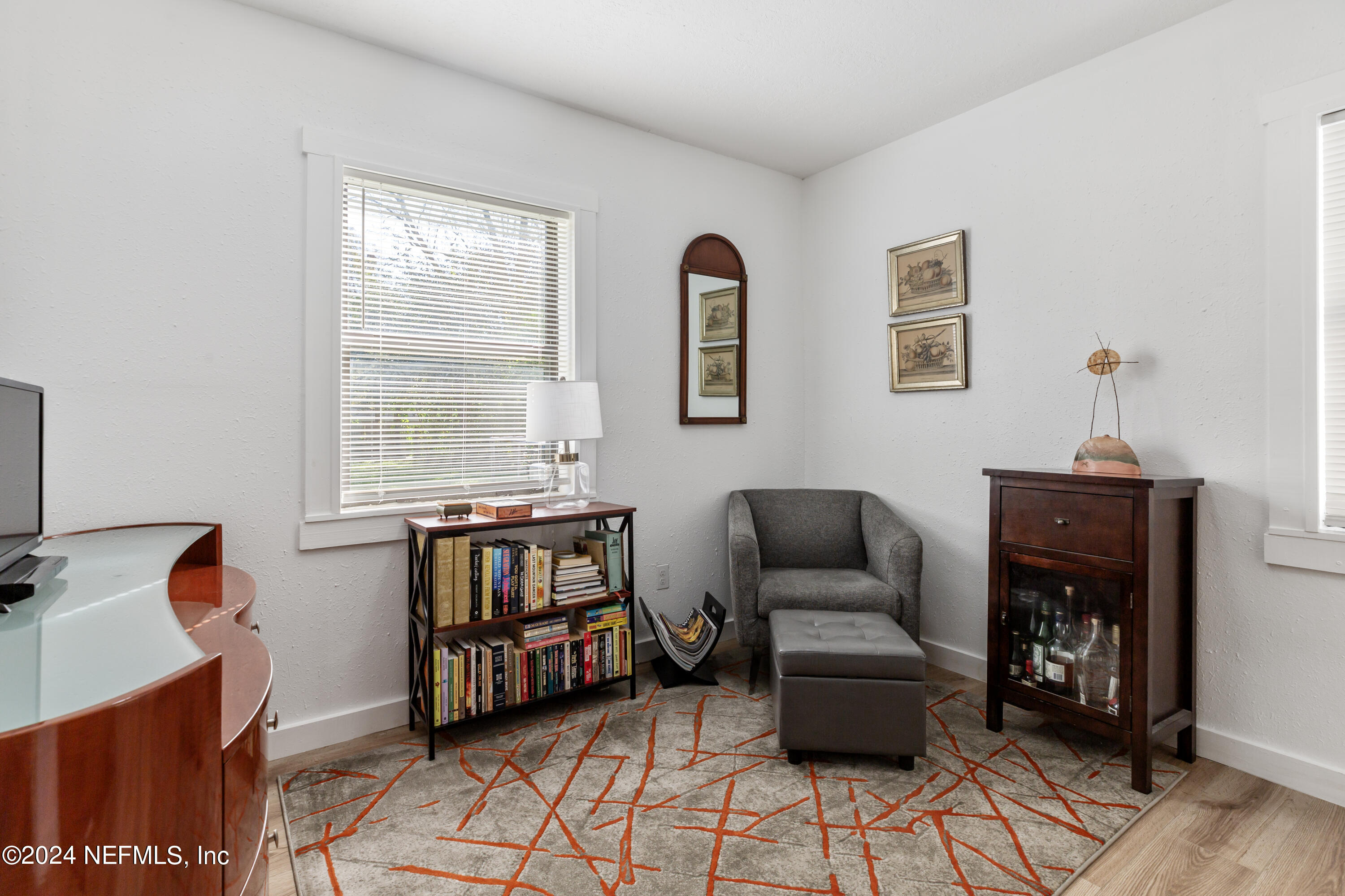 1067 Cahoon Road South Jacksonville, FL 32221 - Photo 11 of 21 a bedroom with furniture and a window