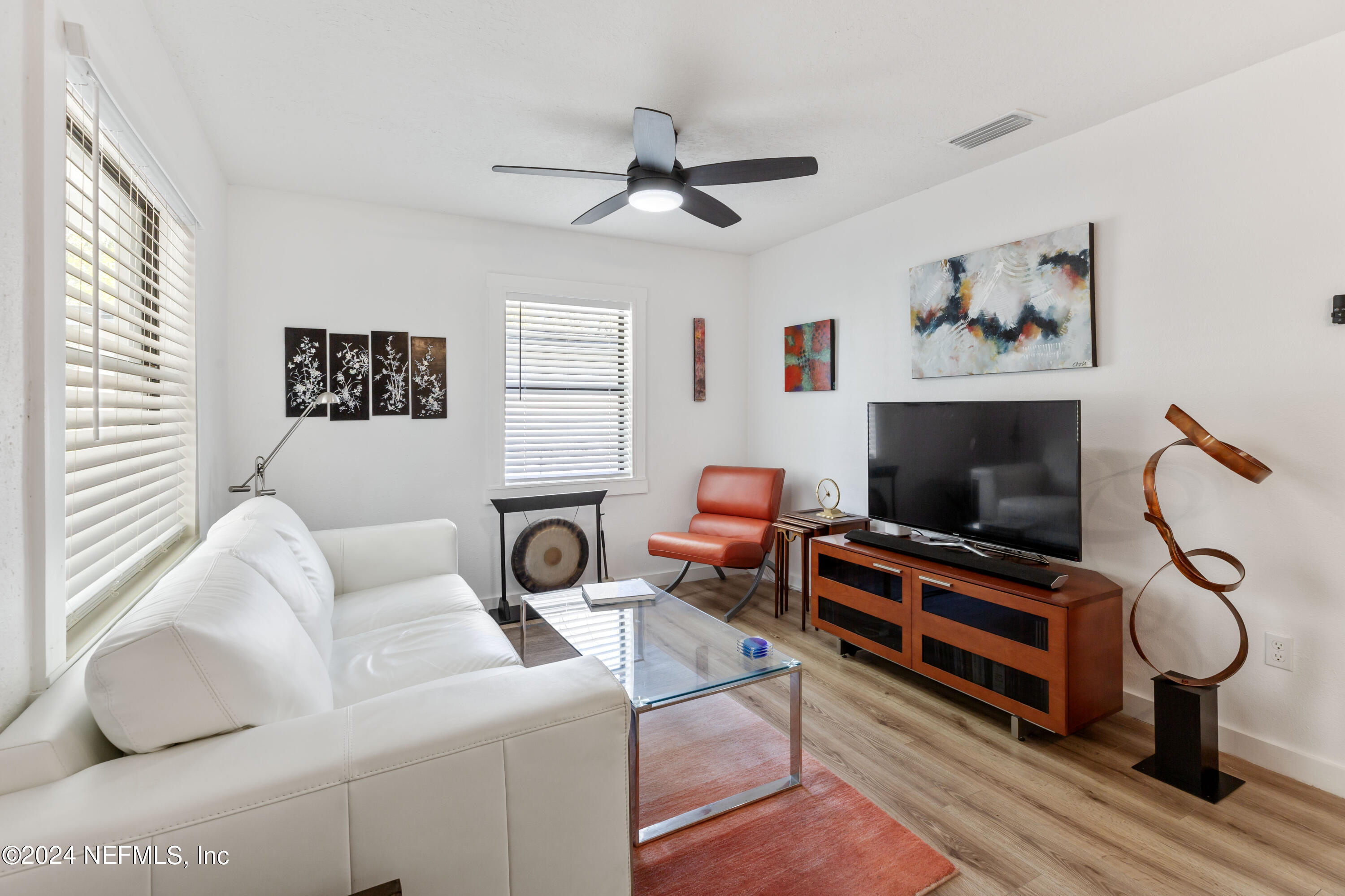 1067 Cahoon Road South Jacksonville, FL 32221 - Photo 5 of 21 a living room with furniture and a flat screen tv