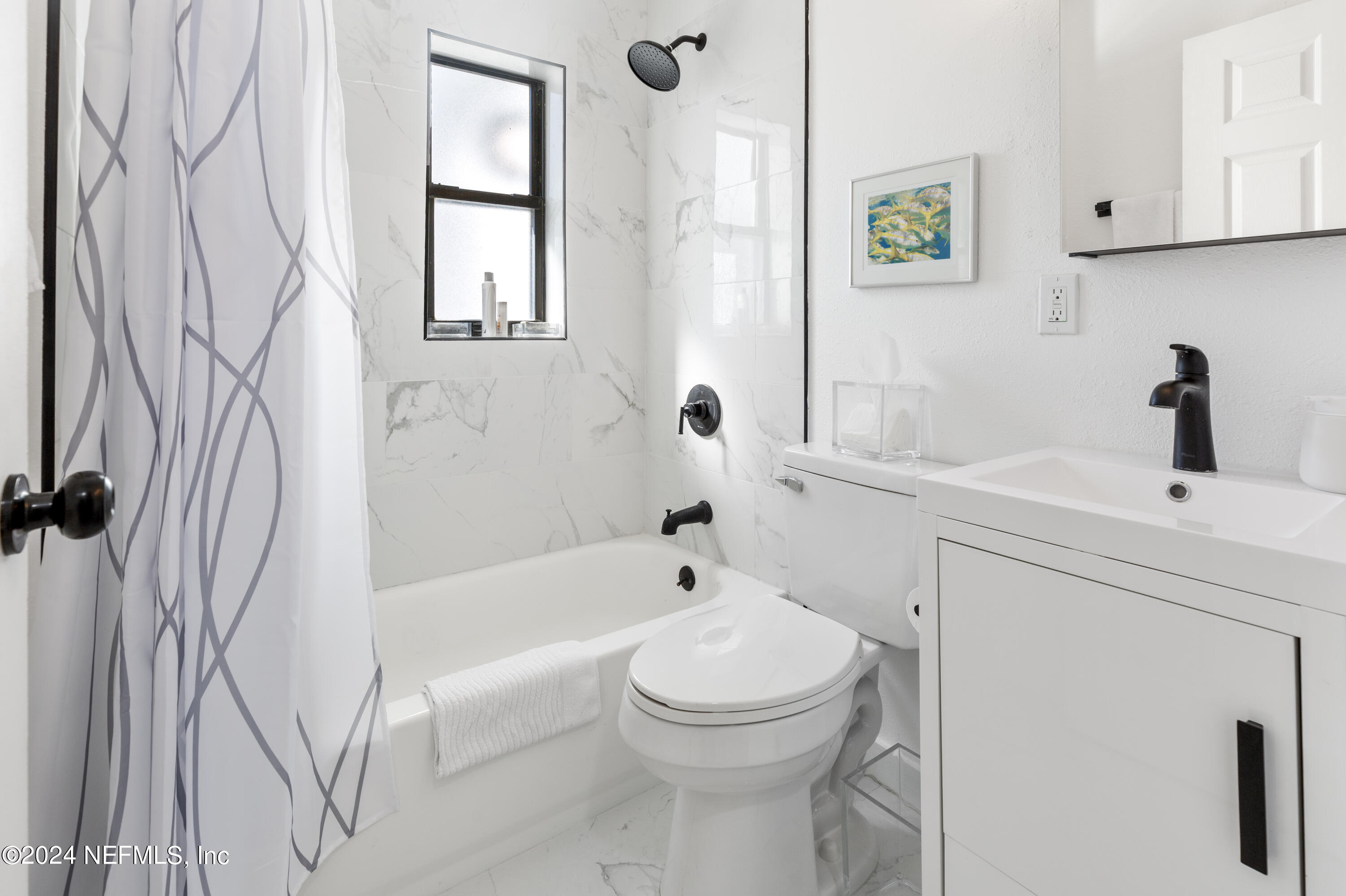 1067 Cahoon Road South Jacksonville, FL 32221 - Photo 9 of 21 a bathroom with a sink a toilet and a bathtub