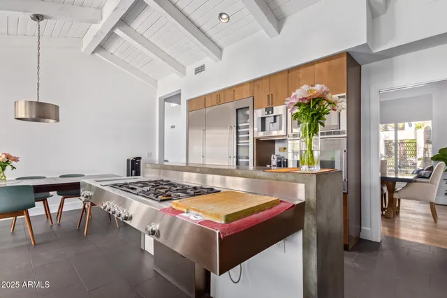 a dining room with a table and chairs