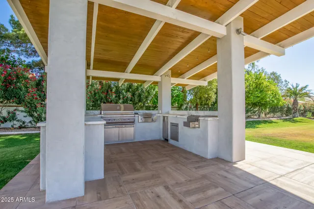 a view of a porch with furniture and garden