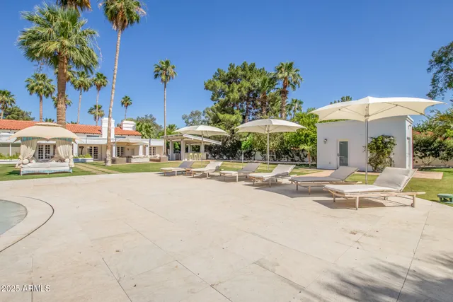 a view of swimming pool with outdoor seating