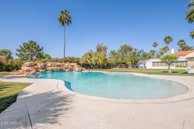 a view of a swimming pool with a lake view