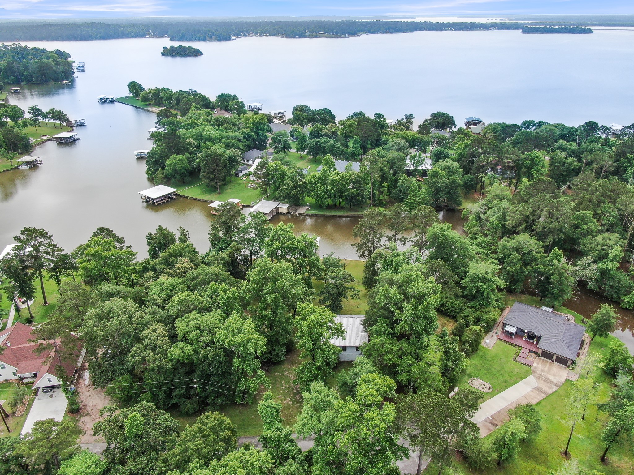 254 Sharp Lane Trinity, TX 75862 - Photo 34 of 36 an aerial view of a house with a lake view