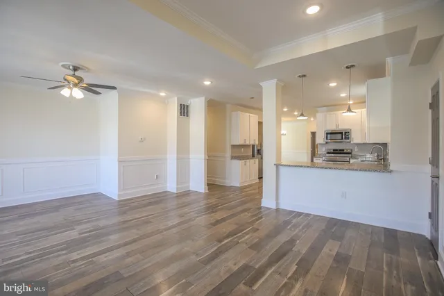 a view of a kitchen with an empty space and a kitchen