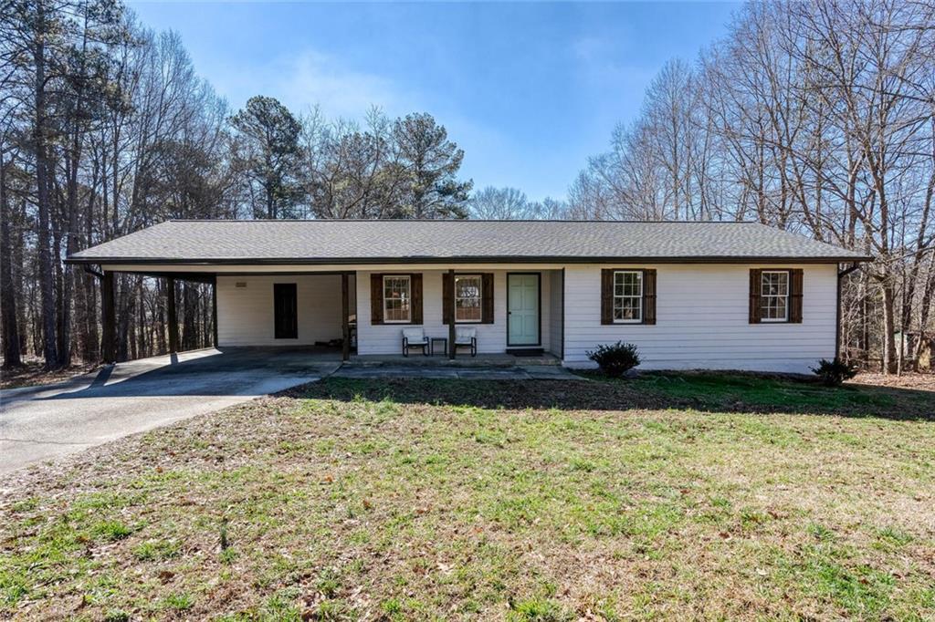 863 Poseyville Road Bremen, GA 30110 - Photo 1 of 1 a front view of a house with garden