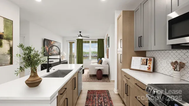 a kitchen with sink a microwave and cabinets