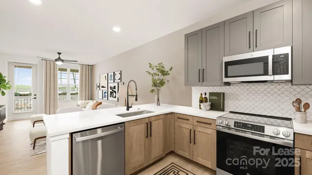 a kitchen with a sink stove and microwave