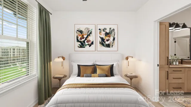a bed room with a bed and painting on the wall