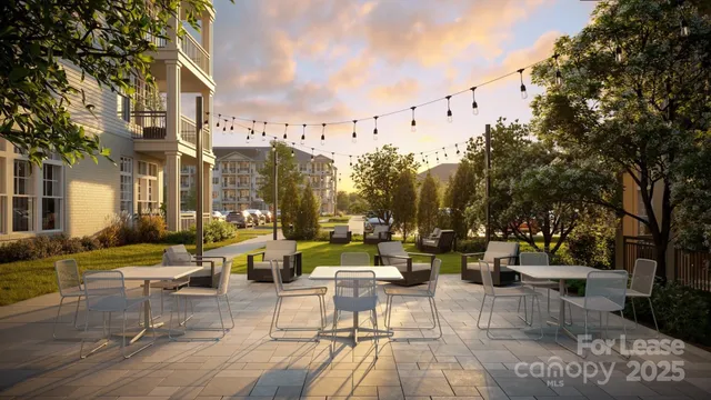 a view of a patio with couches and dining table and chairs with wooden floor and fence