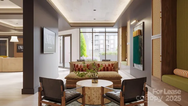 a dining room with furniture and a large window