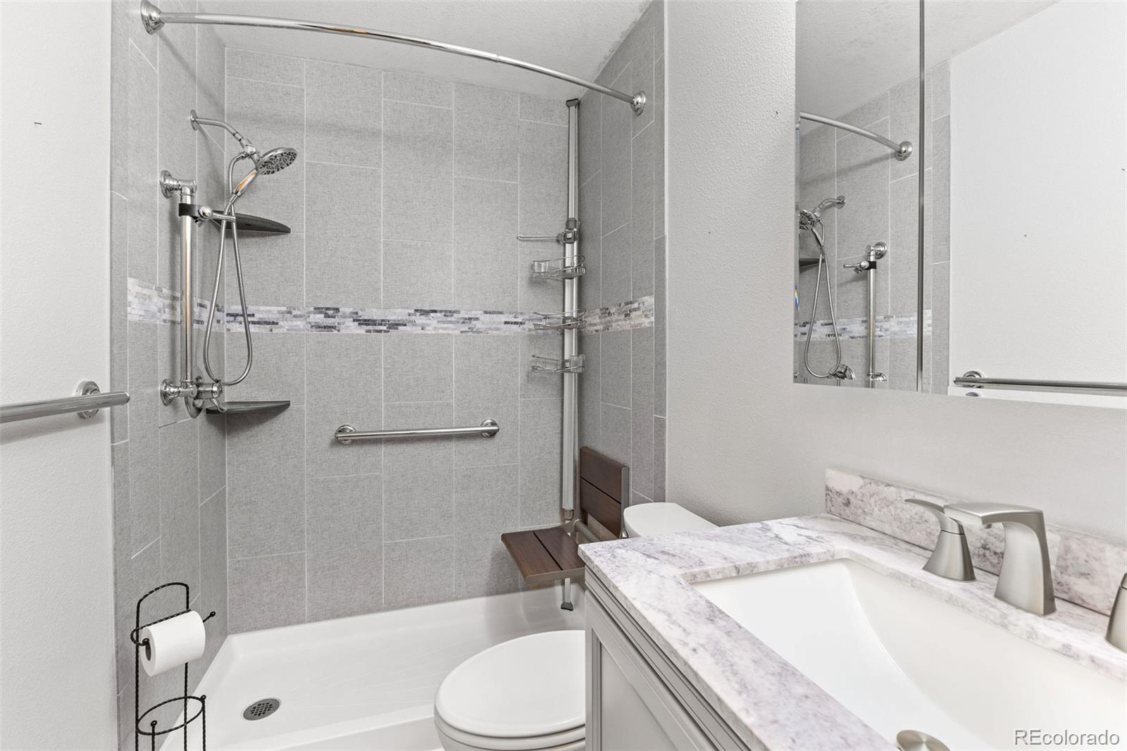 161 Sullivan Street Bailey, CO 80421 - Photo 12 of 32 a bathroom with a granite countertop sink toilet and shower