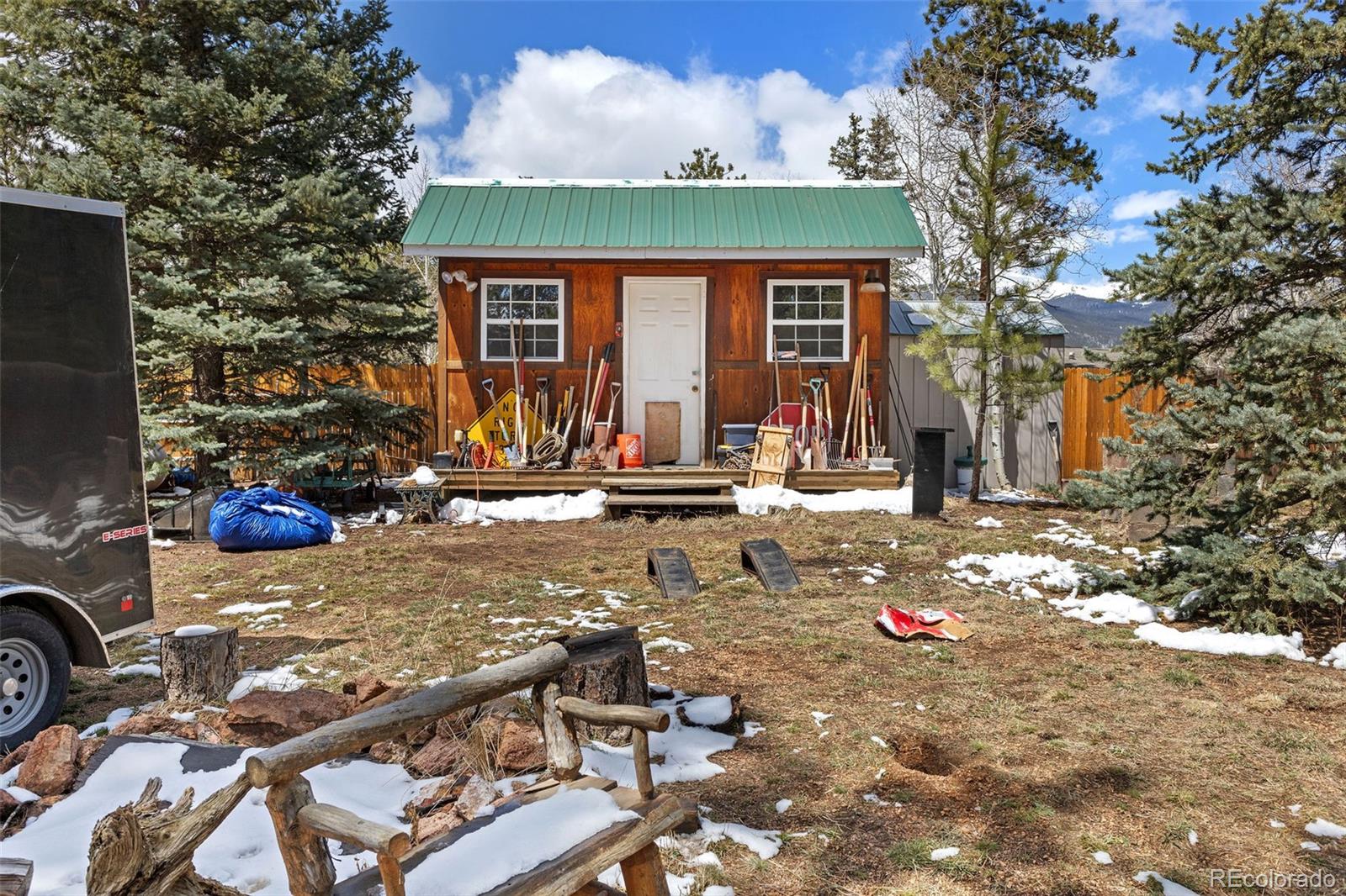 161 Sullivan Street Bailey, CO 80421 - Photo 22 of 32 a front view of a house with parking area