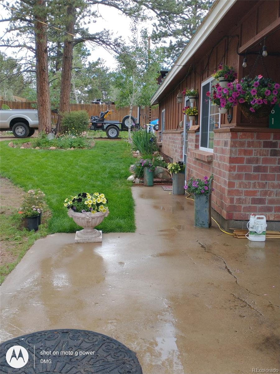 161 Sullivan Street Bailey, CO 80421 - Photo 27 of 32 a front view of a house with garden