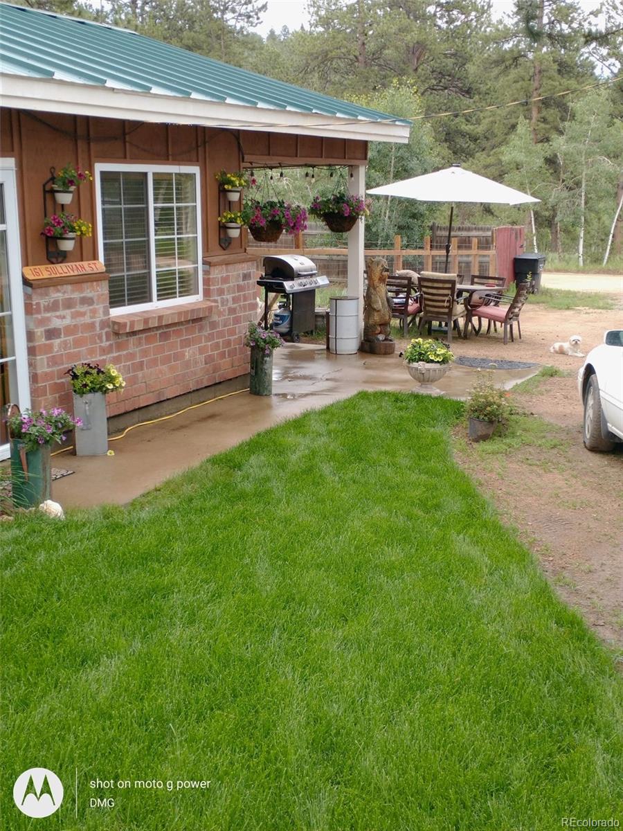 161 Sullivan Street Bailey, CO 80421 - Photo 28 of 32 a view of a house with backyard porch and sitting area