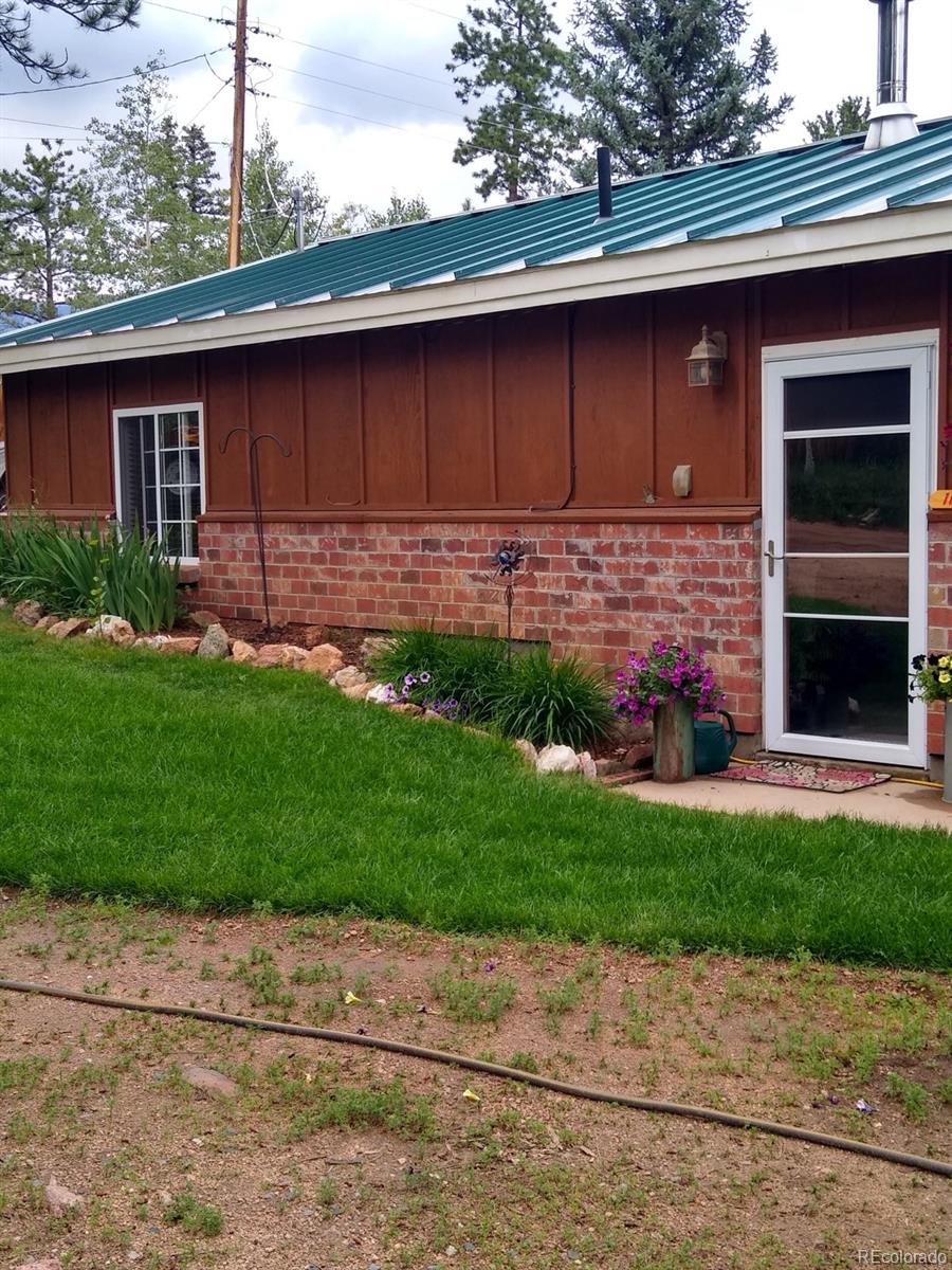 161 Sullivan Street Bailey, CO 80421 - Photo 29 of 32 a front view of a house with a garden