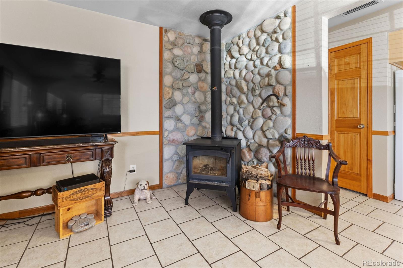 161 Sullivan Street Bailey, CO 80421 - Photo 3 of 32 a living room with furniture and a flat screen tv