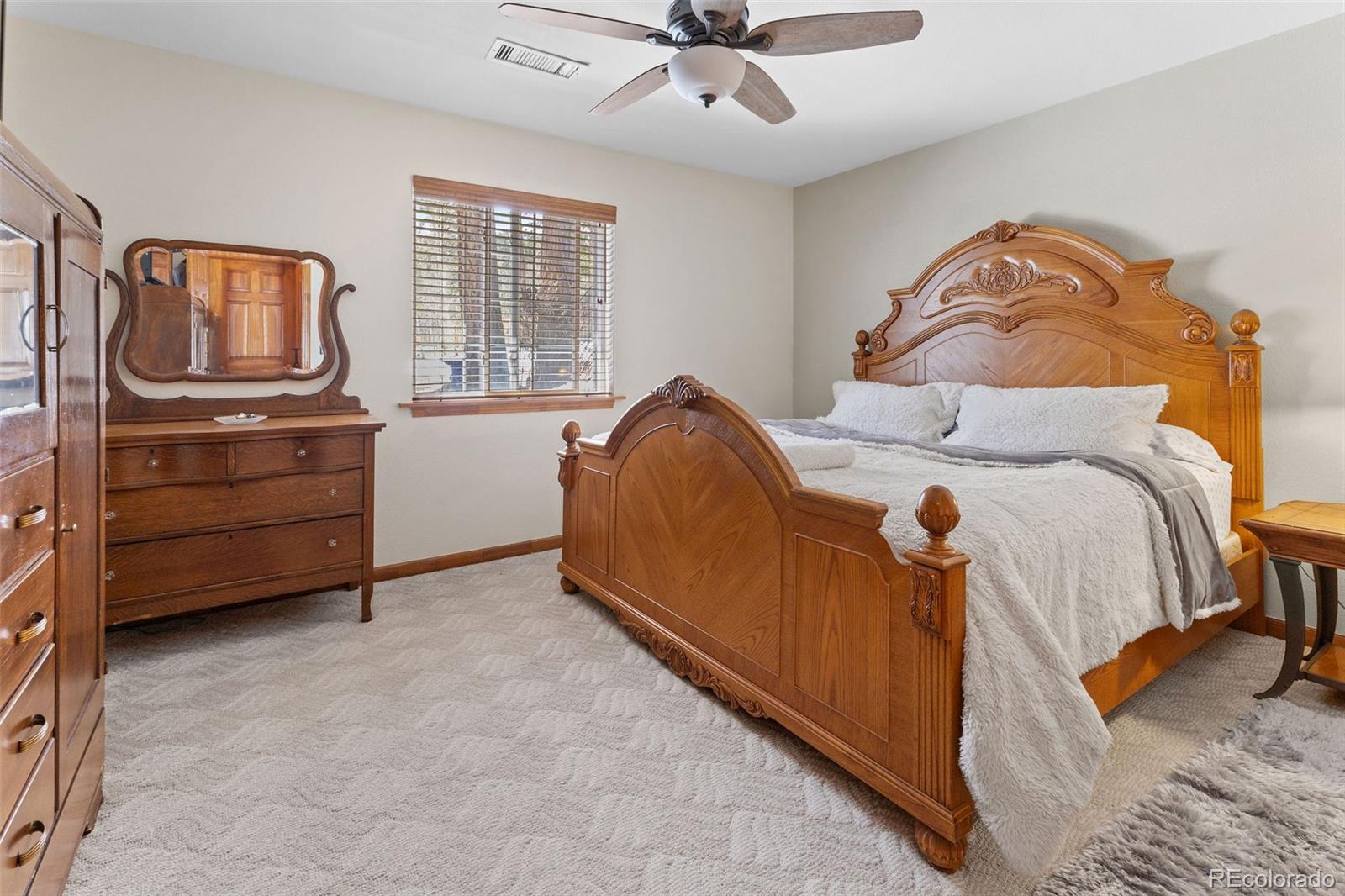 161 Sullivan Street Bailey, CO 80421 - Photo 10 of 32 a bed room with a bed and a dresser