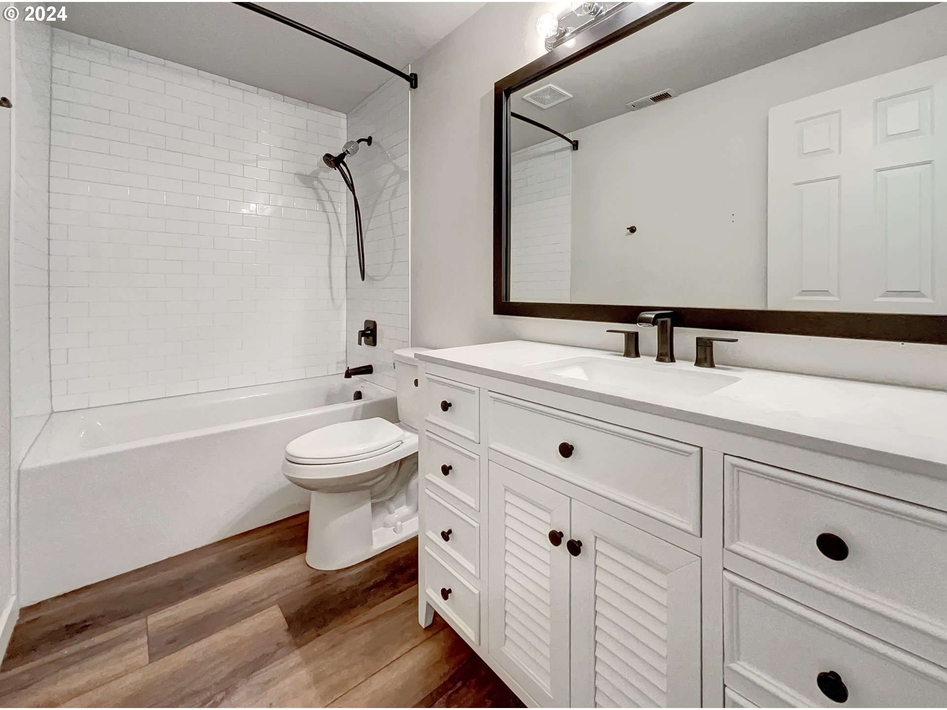 2933 South Cedar Ridge Drive Ridgefield, WA 98642 - Photo 13 of 21 a bathroom with a sink a toilet and a mirror