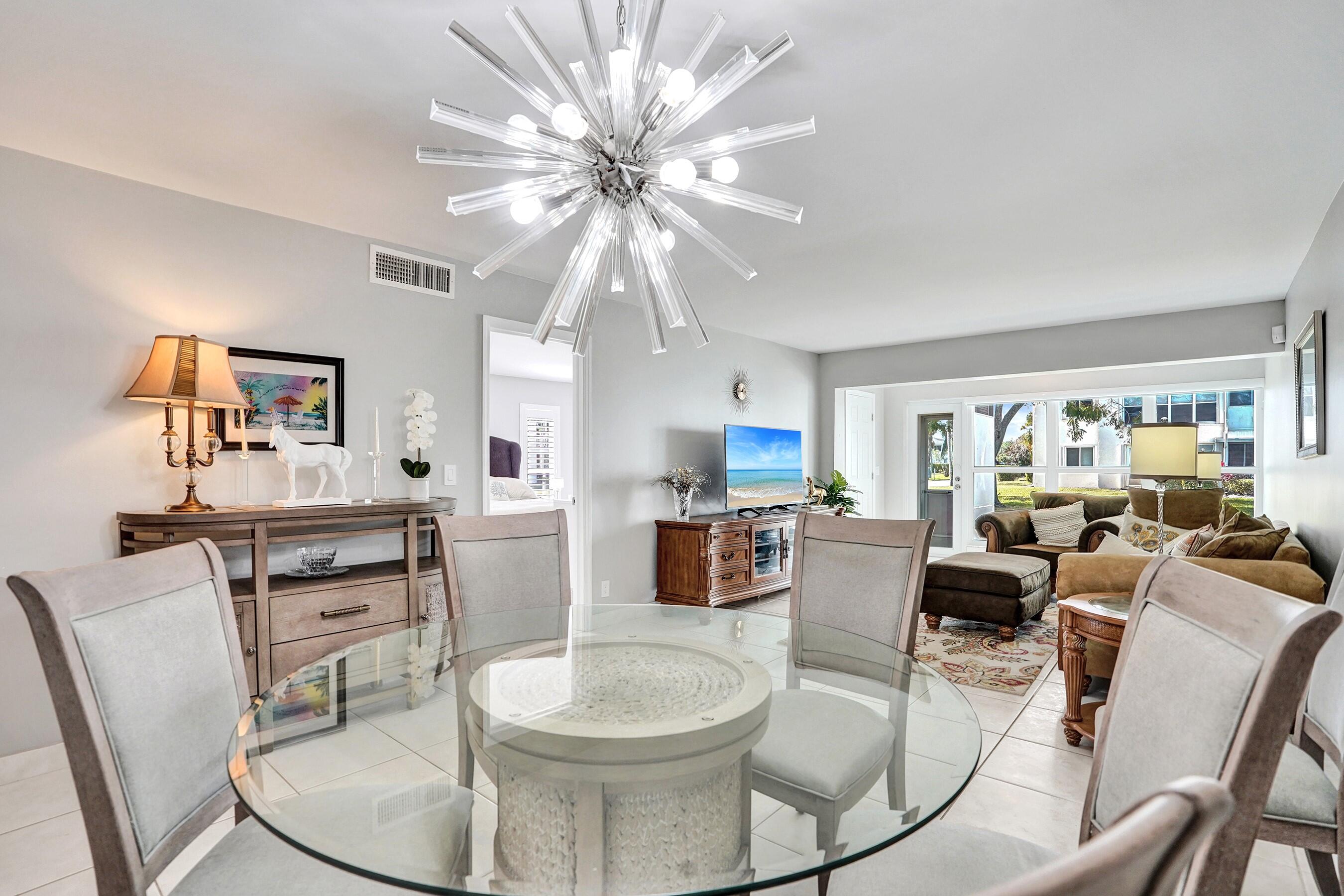 1435 Southwest 27th Avenue, Unit 101 Delray Beach, FL 33445 - Photo 27 of 59 DINING AREA TO LIVING ROOM
