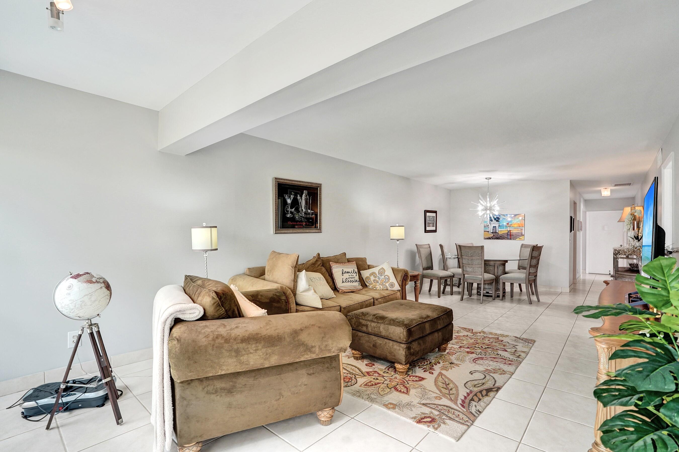 1435 Southwest 27th Avenue, Unit 101 Delray Beach, FL 33445 - Photo 28 of 59 LIVING ROOM TO DINING AREA