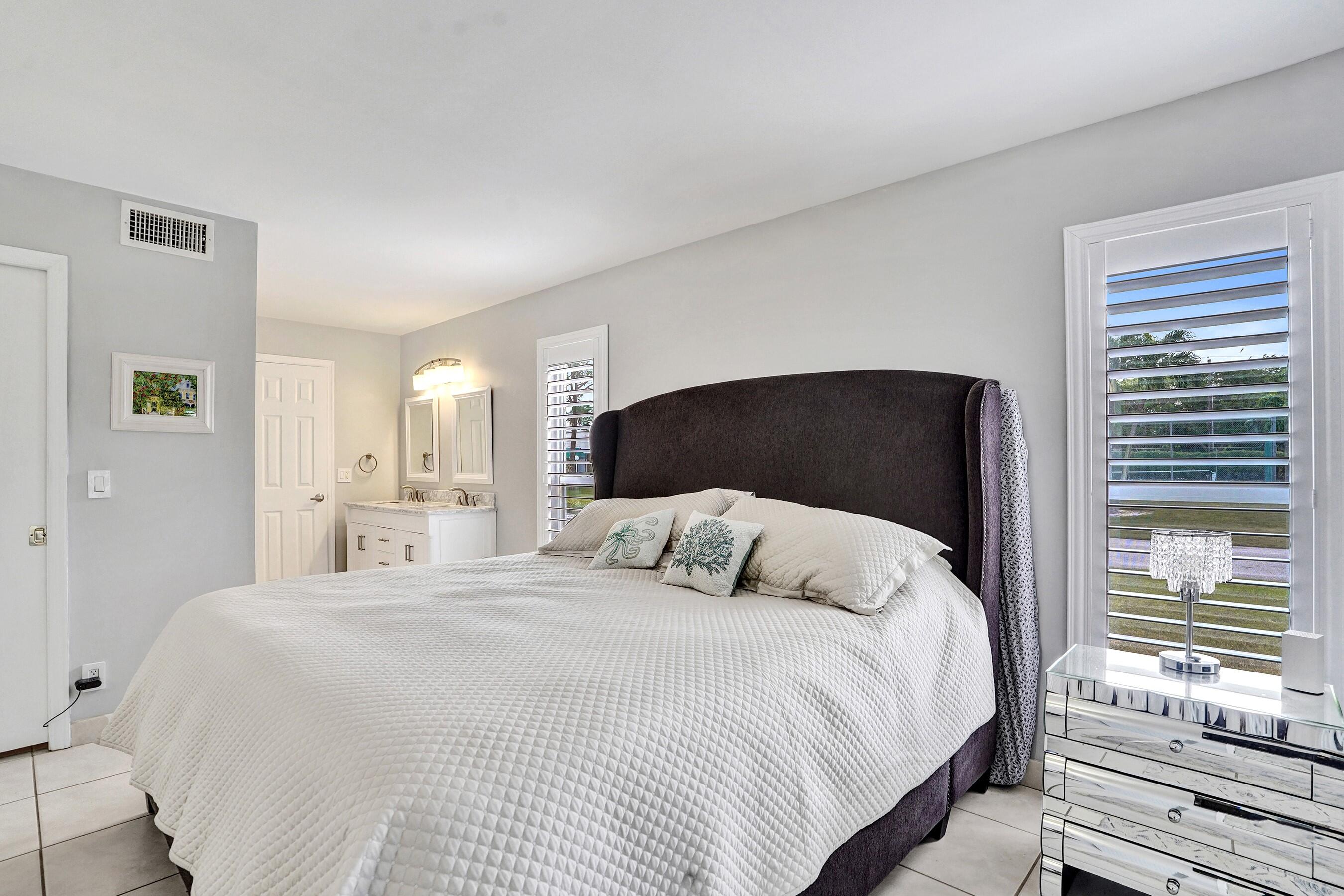 1435 Southwest 27th Avenue, Unit 101 Delray Beach, FL 33445 - Photo 36 of 59 MASTER BEDROOM