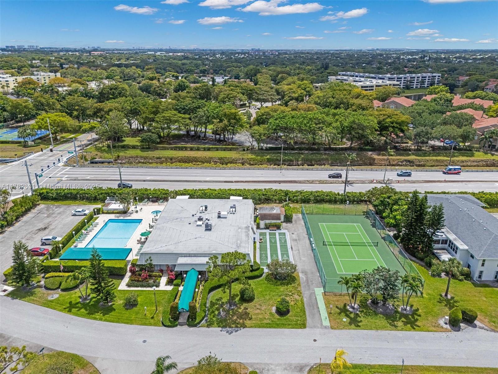 1435 Southwest 27th Avenue, Unit 101 Delray Beach, FL 33445 - Photo 49 of 59 Clubhouse-pool-pickleball
