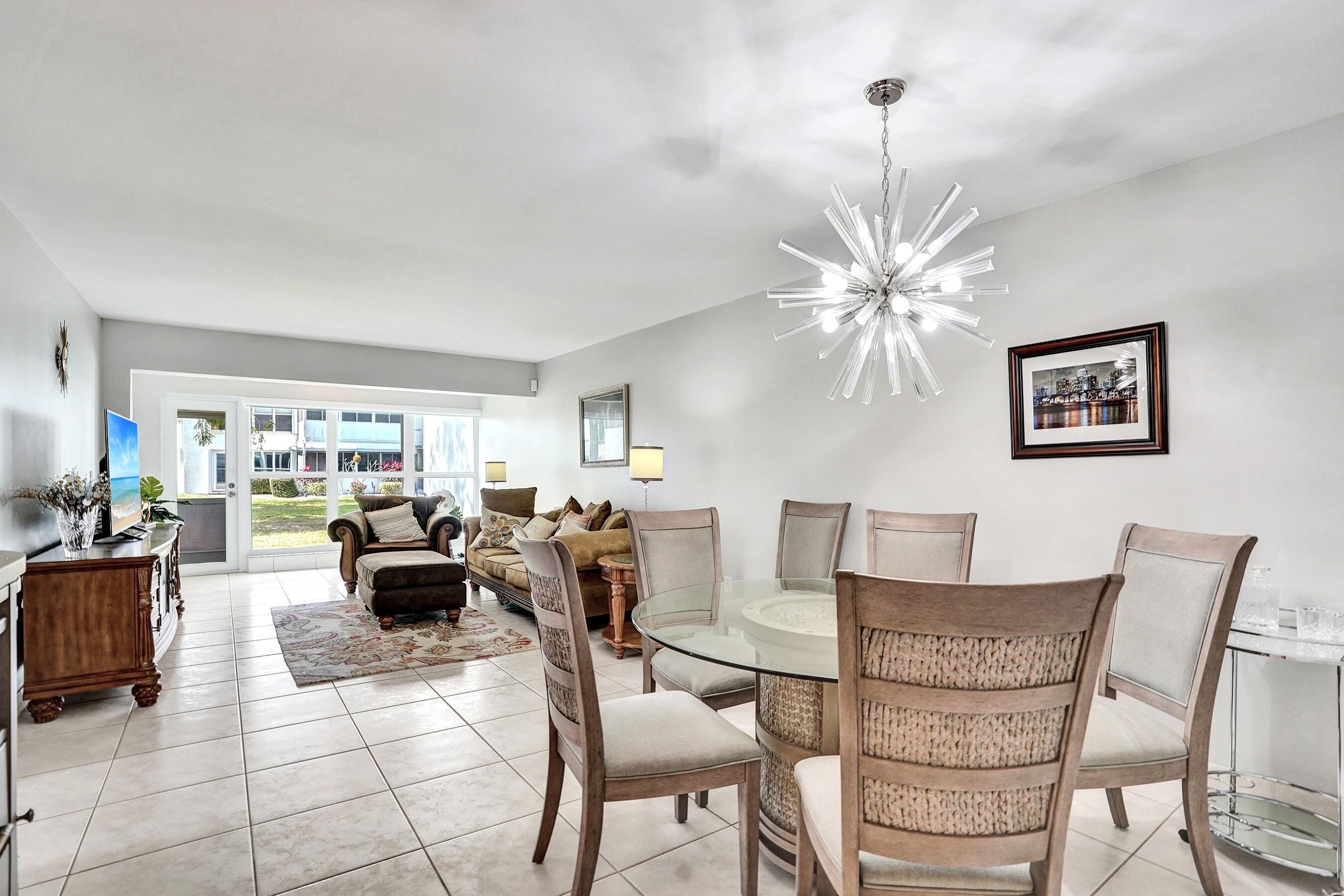 1435 Southwest 27th Avenue, Unit 101 Delray Beach, FL 33445 - Photo 5 of 59 Dining area to living room