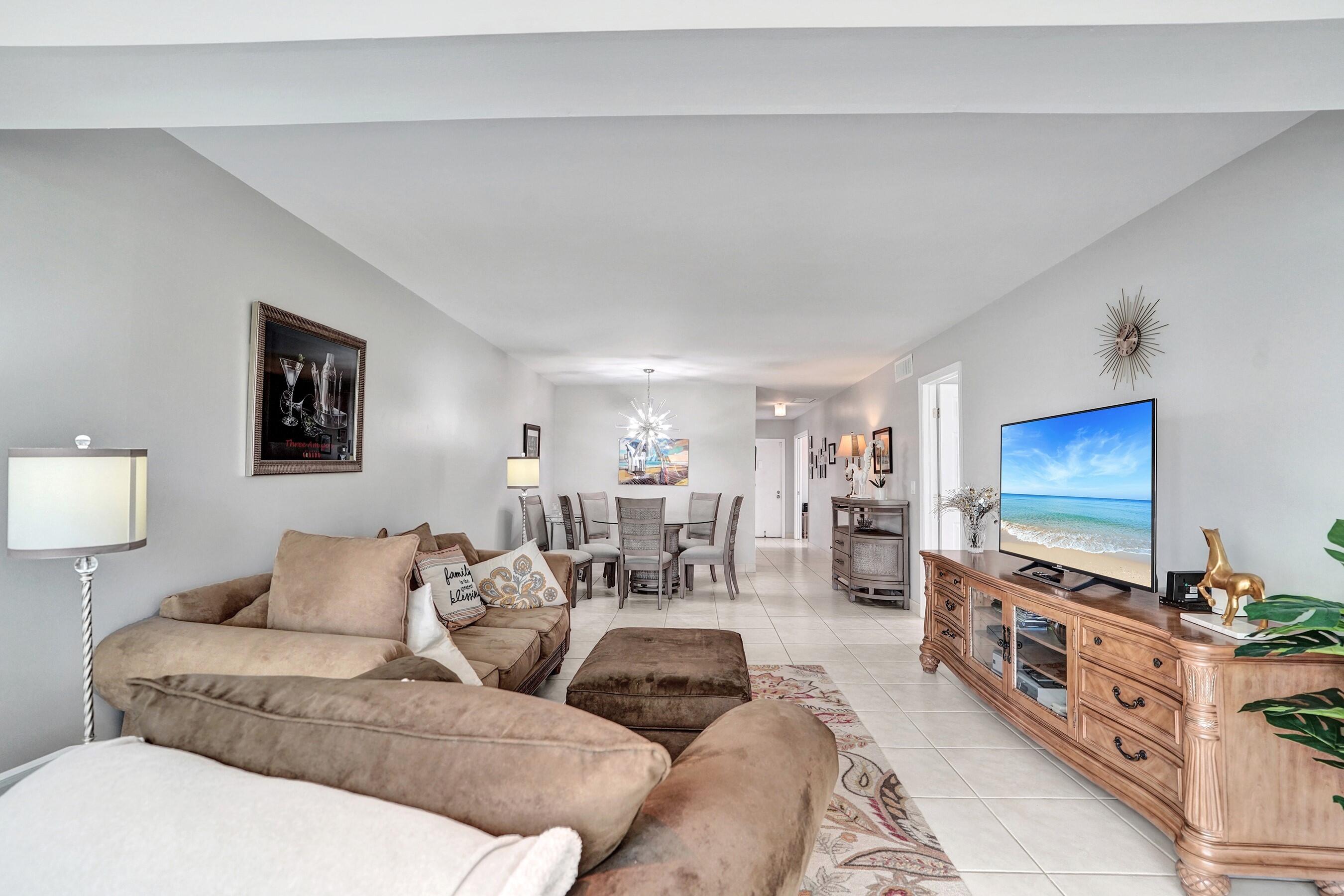 1435 Southwest 27th Avenue, Unit 101 Delray Beach, FL 33445 - Photo 6 of 59 Living room to dining area