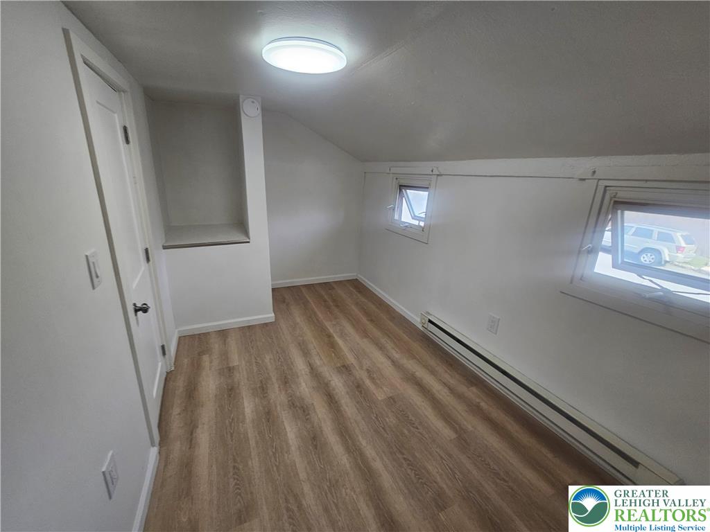23 West Ruddle Street Coaldale, PA 18218 - Photo 11 of 16 wooden floor in an empty room with a window